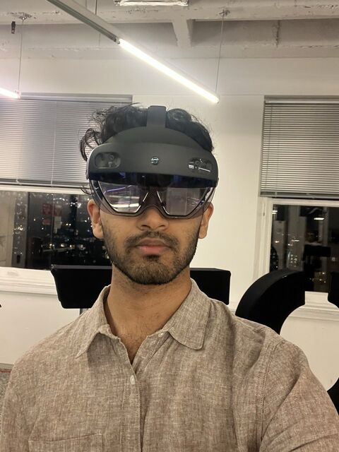 Apoorv wearing a Microsoft HoloLens 2