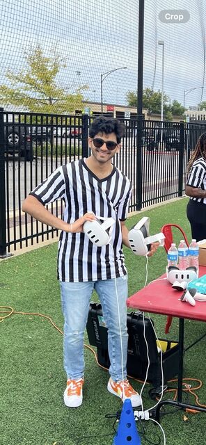 Apoorv holding Meta Quest 3 controllers at an outdoor demo