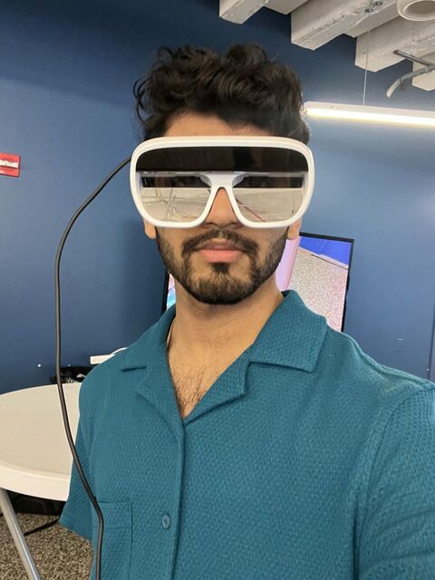 Apoorv wearing Tilt Five AR glasses